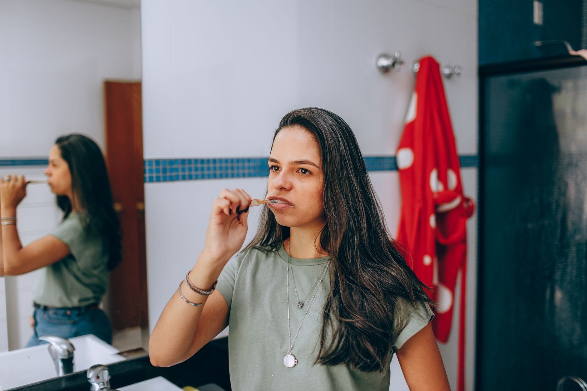 woman brushing teeth