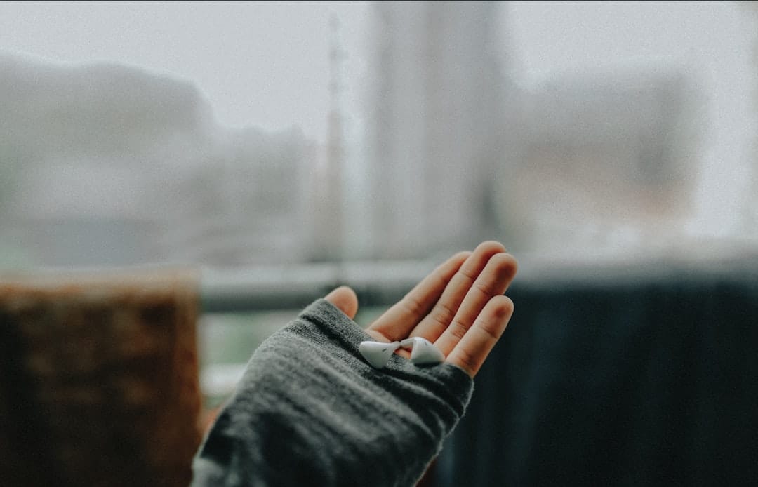 A warm cloth wrapped around a person's hand and wrist