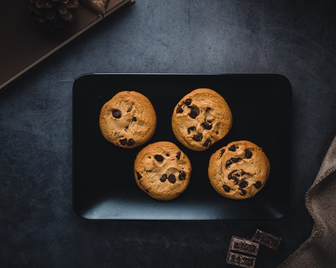 Golden baked cookies cooling on a wire rack in a bright kitchen