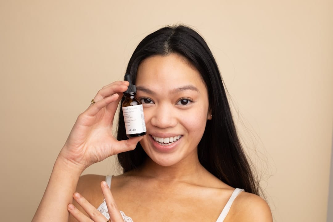 woman applying facial oil