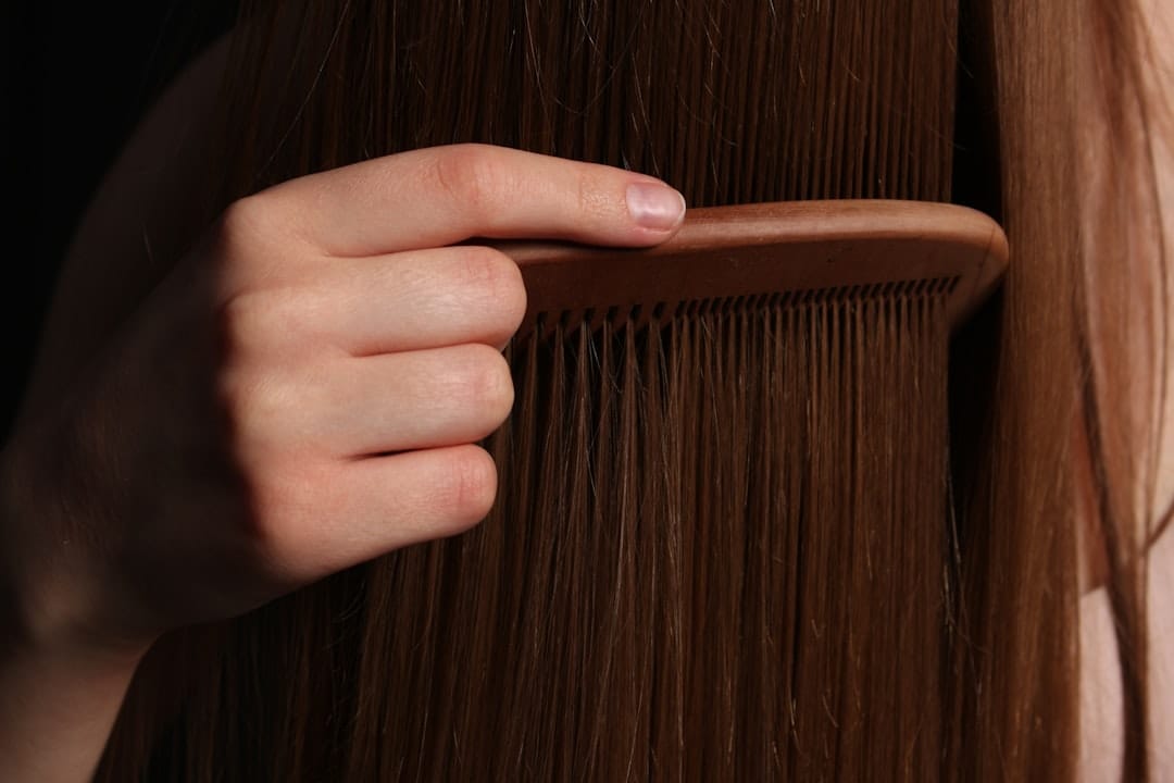 woman brushing shiny hair