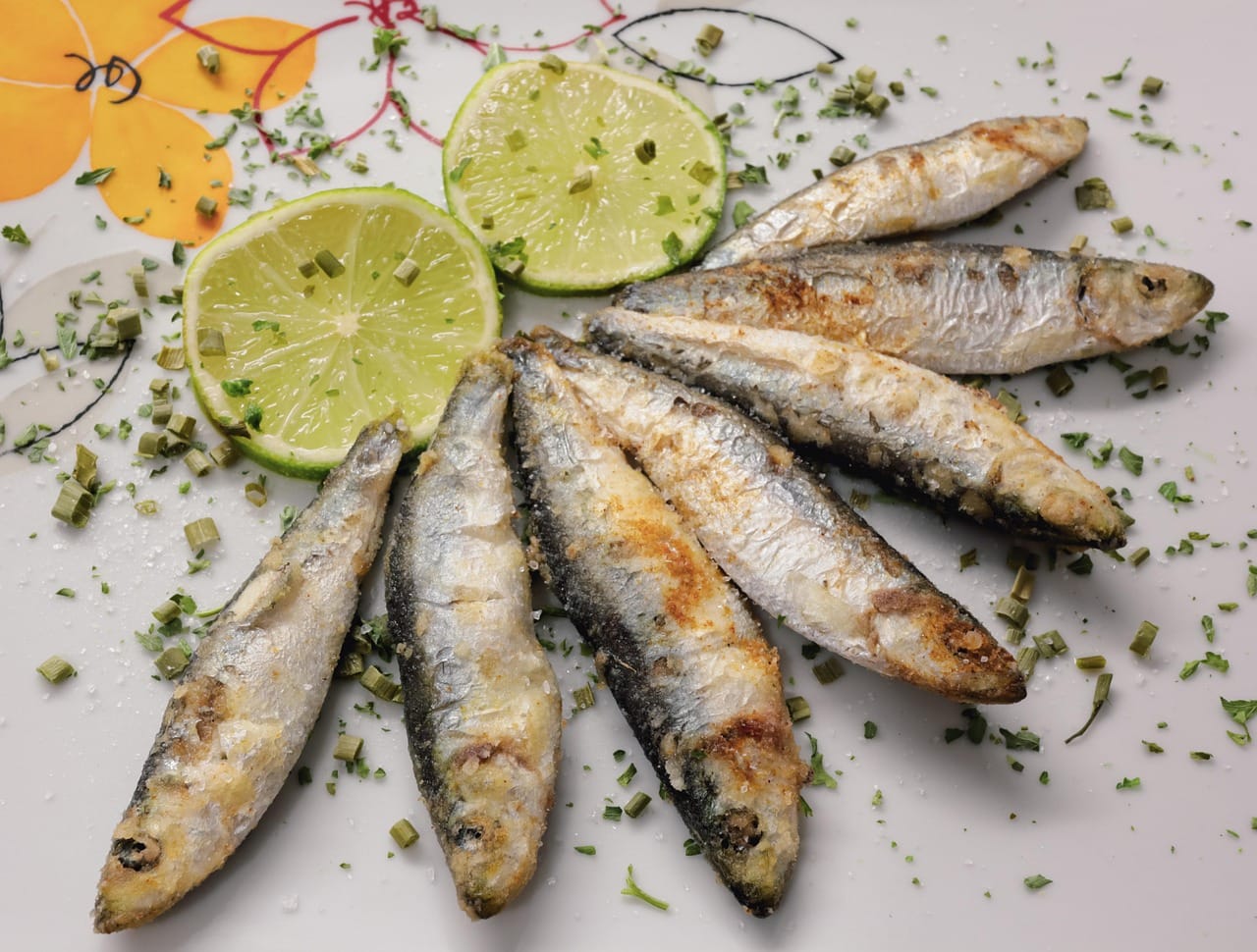Sardine fillets layered over toasted sourdough with lemon and herbs
