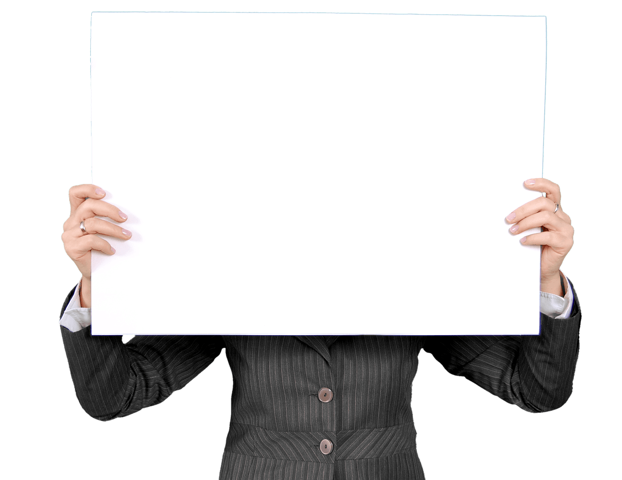A physician in a white coat writing notes on a clipboard