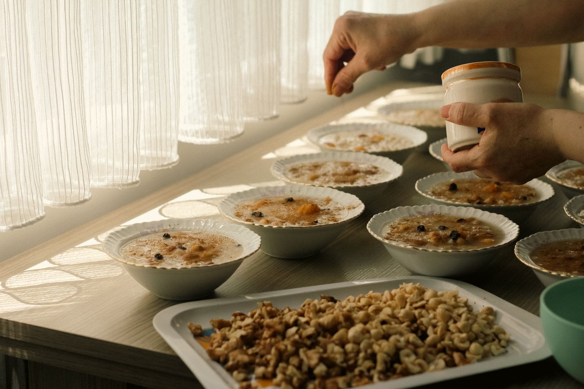 A steaming bowl of oatmeal topped with berries and nuts