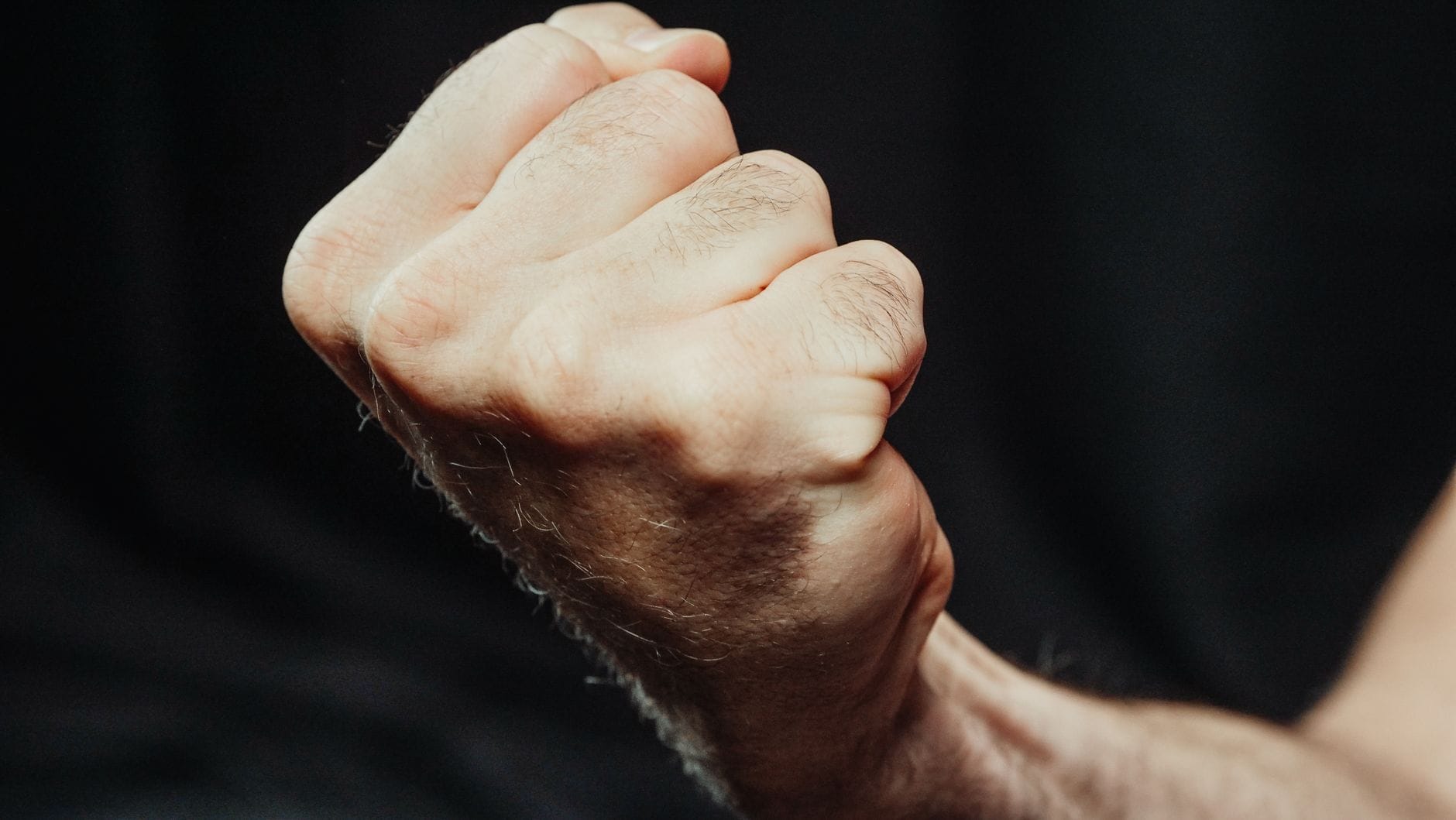 Close-up of a swollen reddened finger knuckle on an older hand