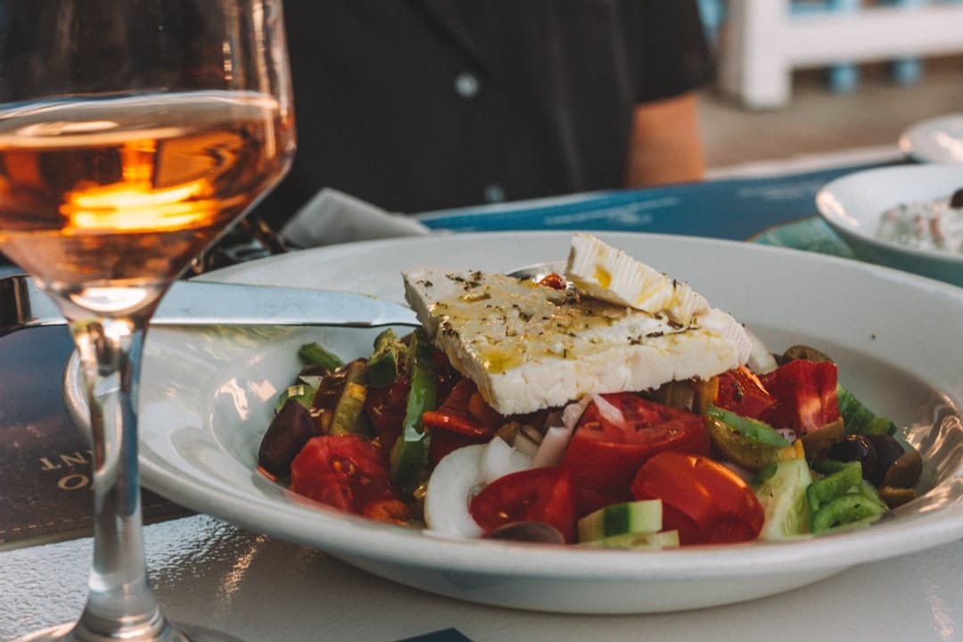 Fresh Greek salad with olives, feta, cucumber, and red onion on a plate