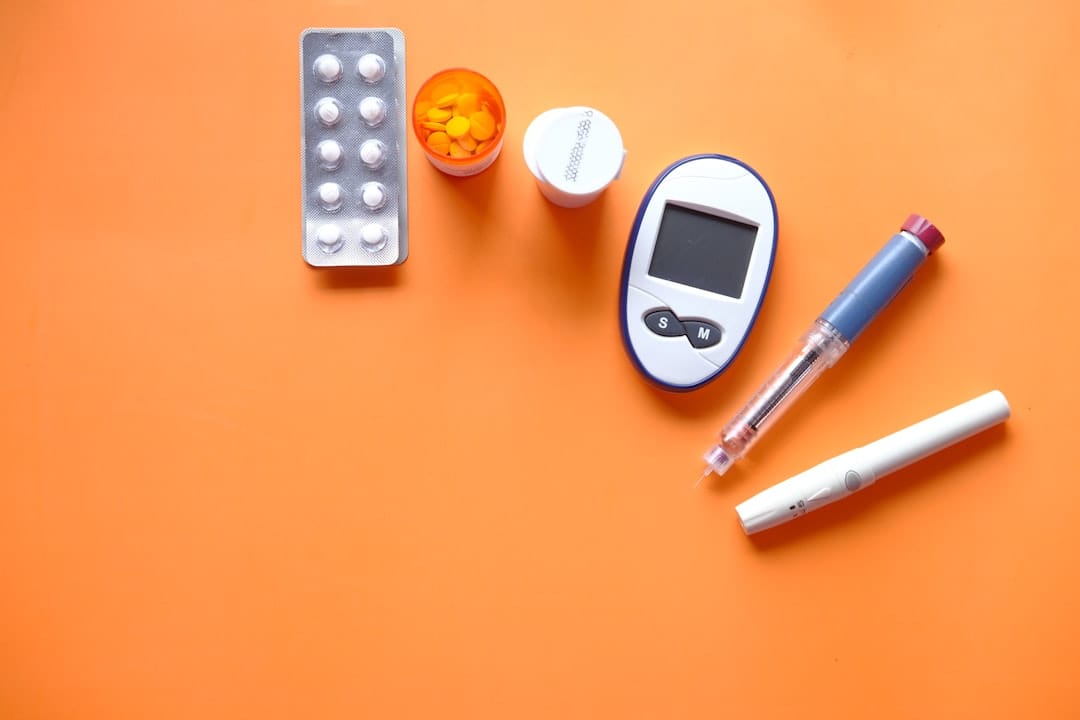 A person checking blood glucose with a fingertip meter