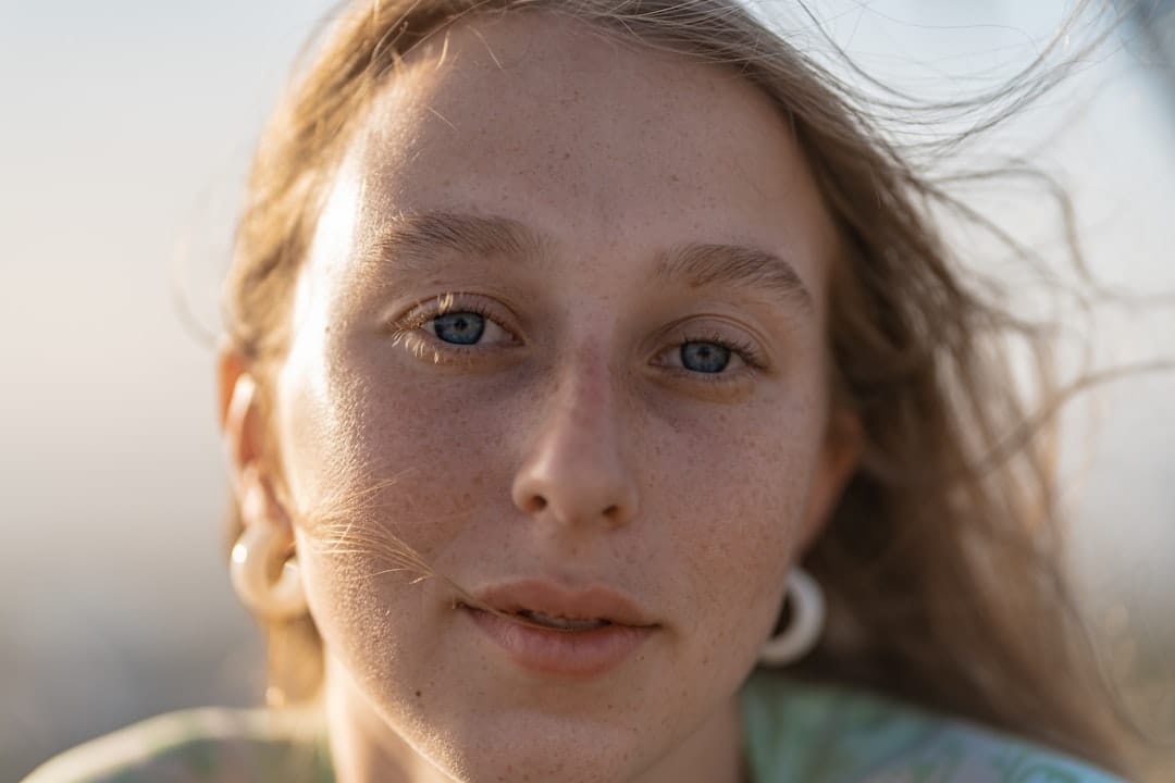 Close-up of a smiling woman with clear, even-toned skin